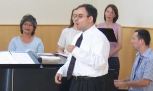 Marc DelMonico leads the choir at Washington Theological Union